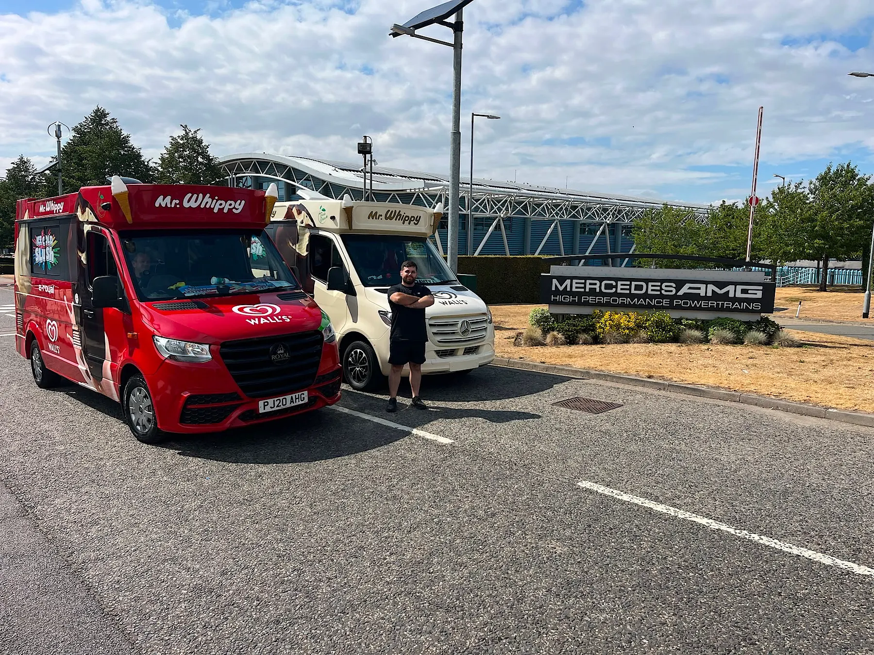 Two Kreamy Delights ice cream vans, one red and one cream